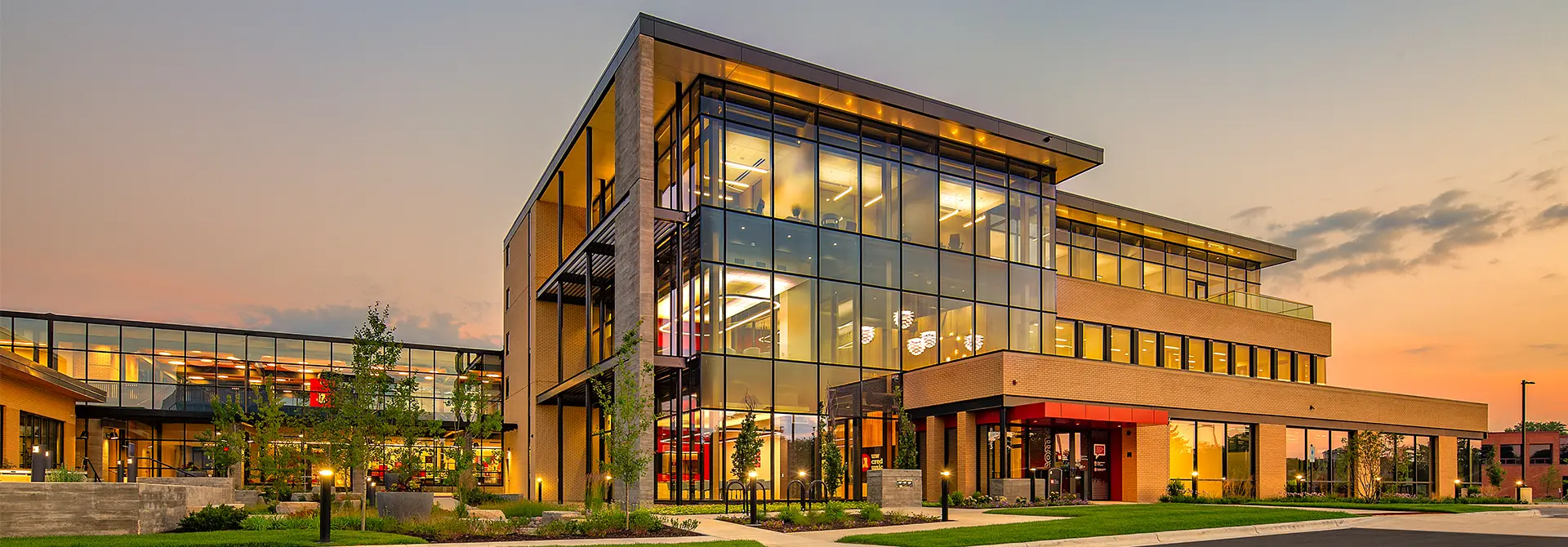 An exterior image of UW Credit Unions Corporate Campus, pictured at sunset. 