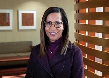 Sheila Milton, Vice President of Diversity, Equity and Inclusion. Seen wearing dark purple blazer and glasses.